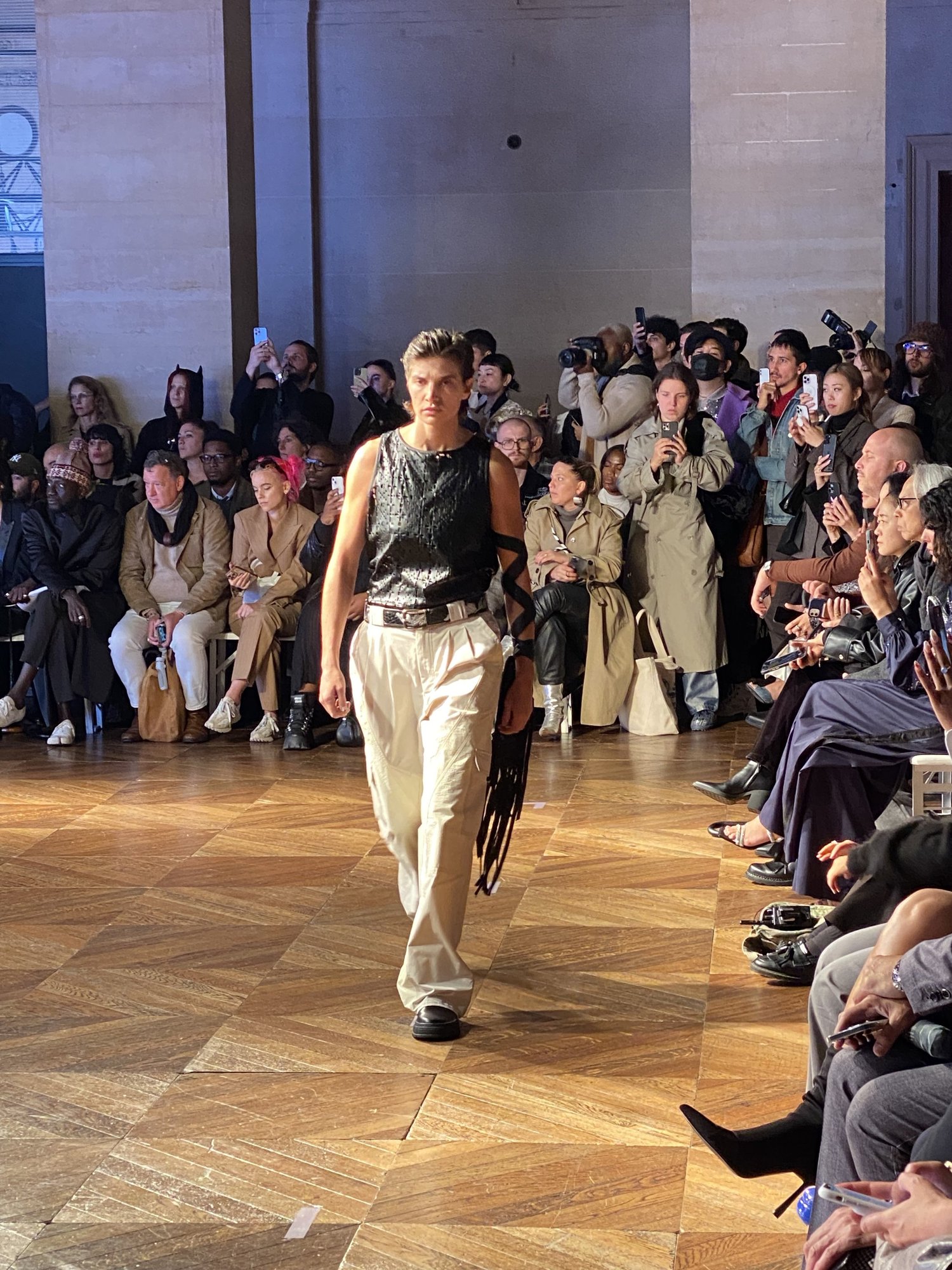 Models walking a runway during Paris Fashion Week